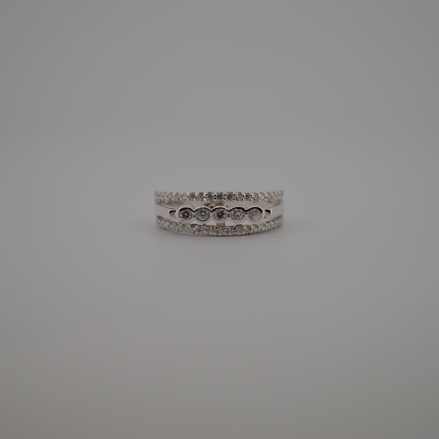 Silver ring on a gray background