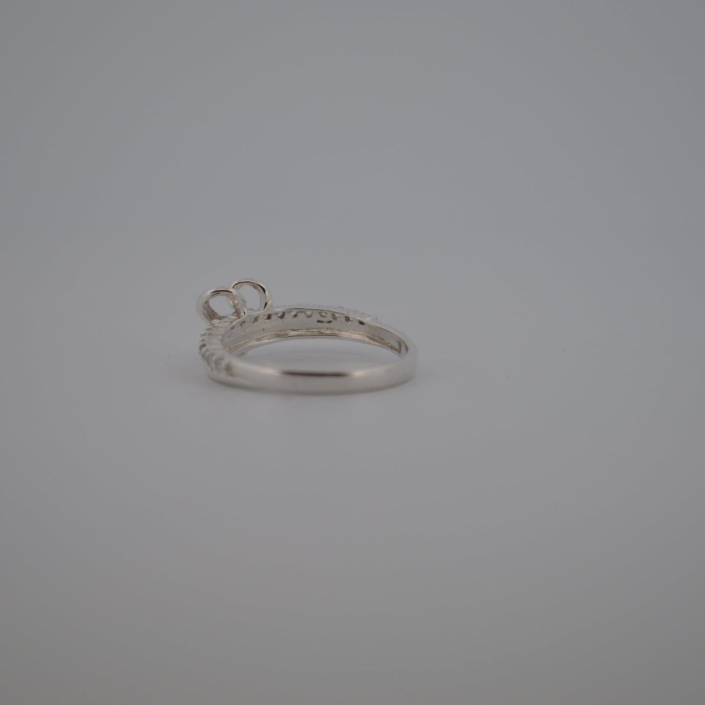 Silver ring on a gray background