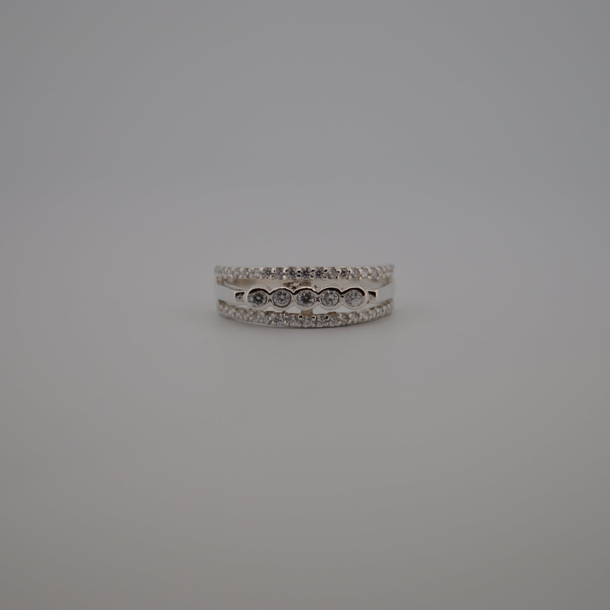 Silver ring on a gray background